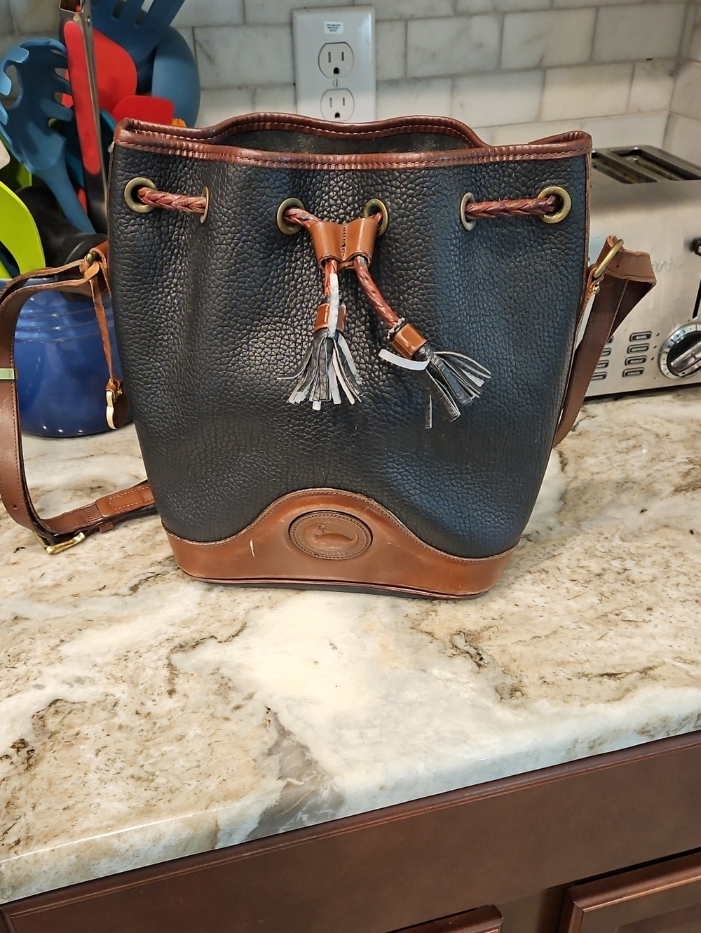 Dooney & Bourke Black Leather Drawstring Bucket Bag with Brown Trim